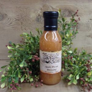 Apple Pecan Dressing, Osceola Cheese dressing bottle on a table