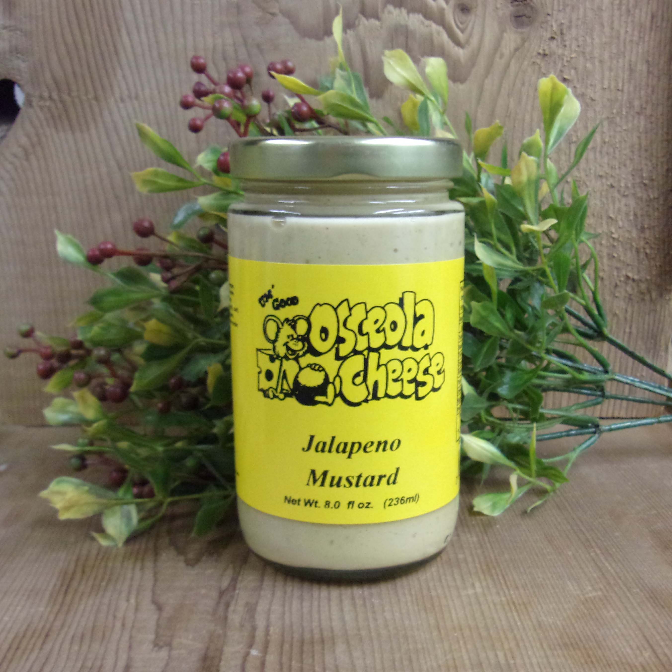 Jalapeno Mustard, Osceola Cheese jar mustard bottle on a table