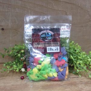 Gummi Rainforest Frogs, Backroad Country bag on a table