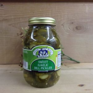 Sweet Garlic Dills PIckles, Amish Wedding pickles jar  on a table