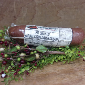 Pit Smoked Natural Casing Summer Sausage, Osceola Cheese sausage on a table