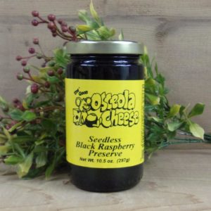 Seedless Black Raspberry Preserve, Osceola Cheese preserve jar on a table