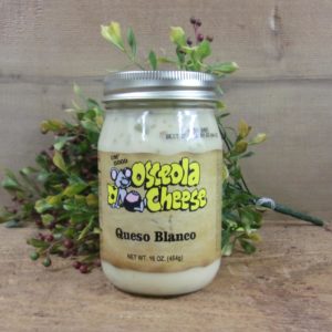 Queso Blanco, Osceola Cheese white cheese sauce jar on a table