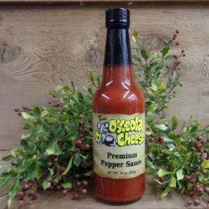 Premium Pepper Sauce, Osceola Cheese sauce bottle on a table