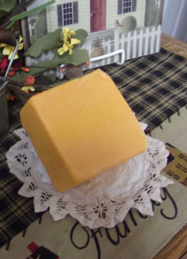 7 Year Cheddar Cheese block on a table