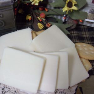 Garlic Havarti cheese blocks on a table