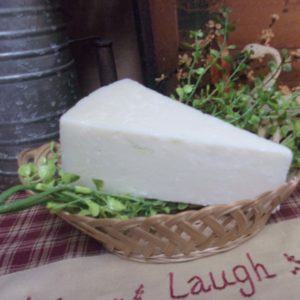 Pecorino Cheese block in a basket on a table