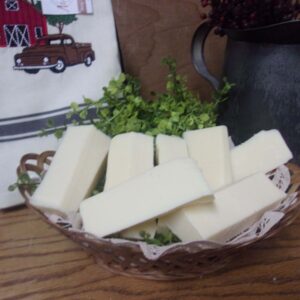 Asiago American Italian Blend cheese slices in a bowl on a table