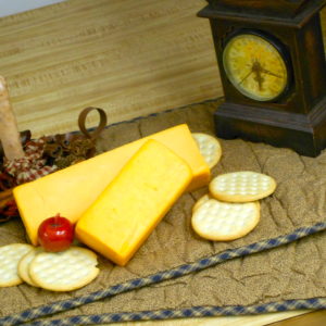 Hickory Smoked 1 Year Nippy Aged Cheddar cheese blocks on a table