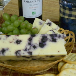 Blueberry White Cheddar, cheese blocks in a basket on a table