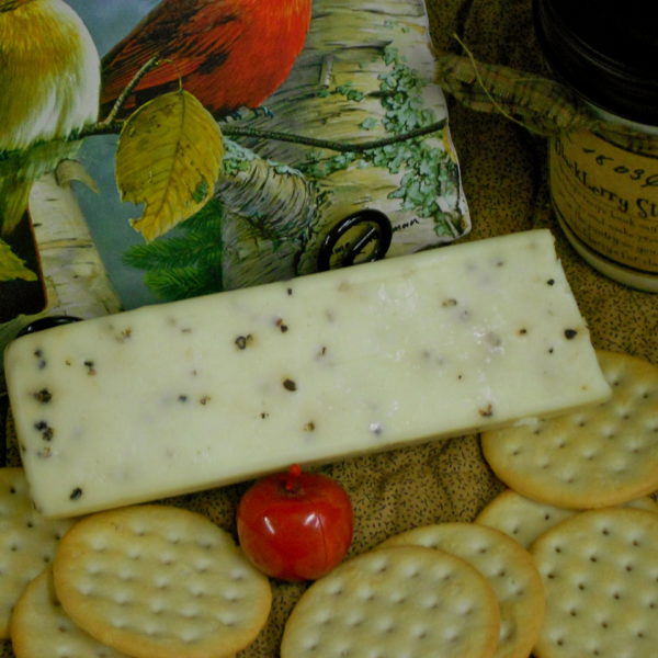 Black Pepper Monterey Jack cheese block on a table