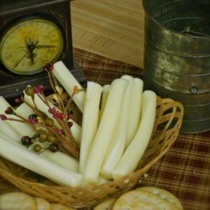 String Cheese tubes in a basket on a table
