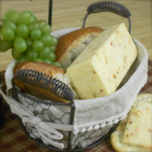 Chicken Monterey Jack cheese block in a basket on a table