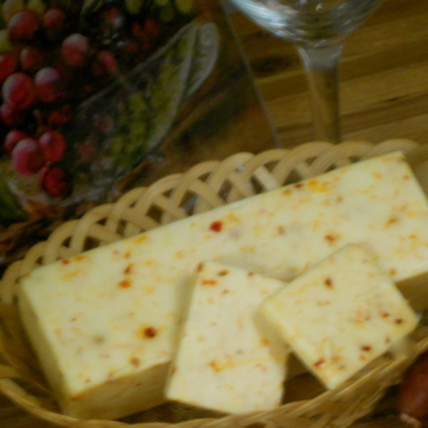 Hickory Smoked Chipotle Monterey Jack cheese blocks in a basket on a table