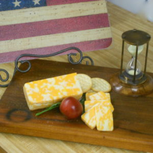 Cheddar Jack, cheese blocks on cutting board on a table