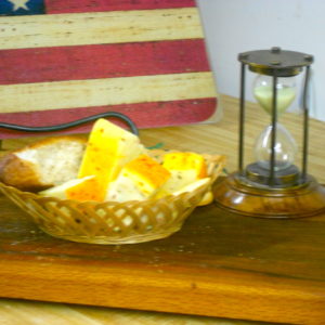 Hickory Smoked Muenster with Jalapenos cheese blocks in a basket on a table