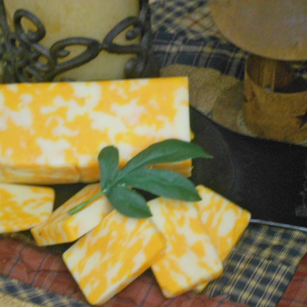 Hickory Smoked Cheddar Jack cheese blocks on a table