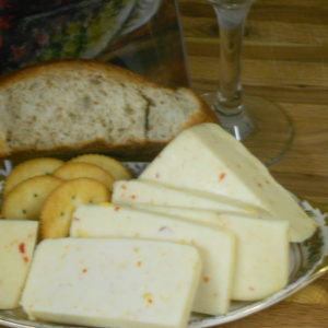 Hickory Smoked Caribbean Red Hot Monterey Jack cheese blocks on a plate on a table