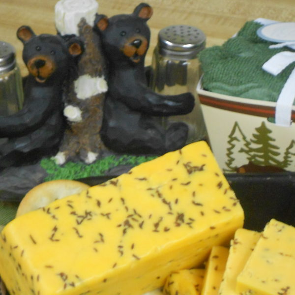 Cheddar and Rye cheese blocks in a bowl on a table