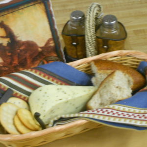Hickory Smoked Morel Mushroom and Leek Monterey Jack cheese block in a basket on a table