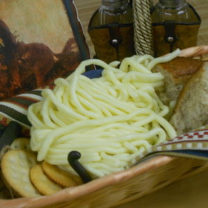 Shoe String String Cheese in a basket on a table