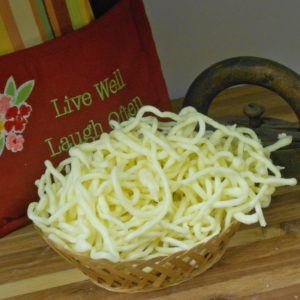 Hickory Smoked Shoe String String Cheese in a basket on a table