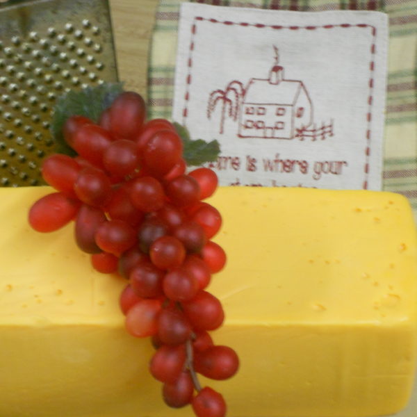 Five Pound Yellow American, block of cheese on a table