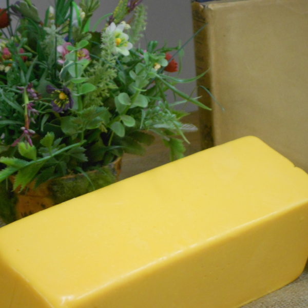 Sharp American 5 Pound cheese block  block on a table