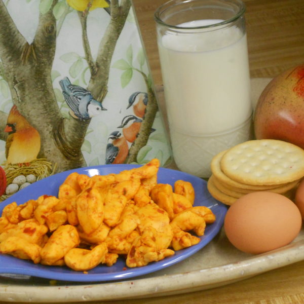 Hot Pepper Curds, cheese pieces on a plate on a table