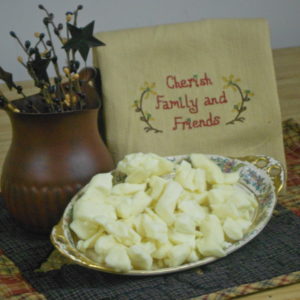 White Cheddar Curds cheese pieces on a platter on a table