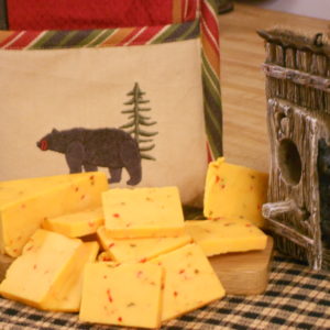 Aged Hot Pepper Cheddar, cheese blocks on a table