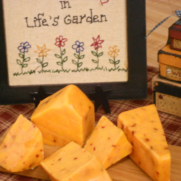 Hickory Smoked Sharp Hot Pepper Cheddar cheese blocks on a table