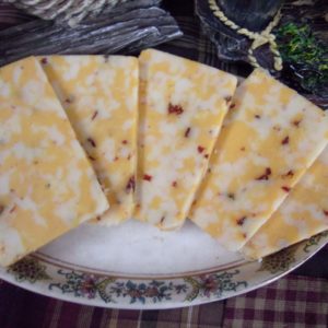 Dynamite Co-Jack cheese slices on a plate on a table