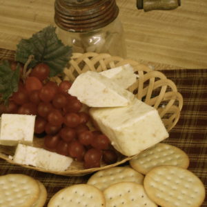 Hickory Smoked Apple Cinnamon cheese pieces in a basket on a table