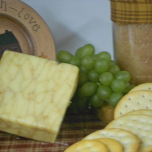 Hickory Smoked Maple White Cheddar cheese block on a table