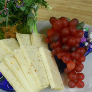 Tomato & Basil Jack cheese slices on a table