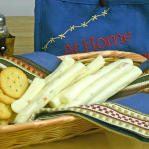 Hot Pepper String cheese tubes in a basket on a table